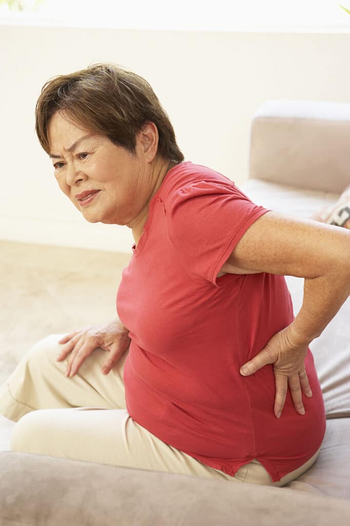 Assisted living at home providers help seniors with chronic back pain with vital support around the home and personal care.