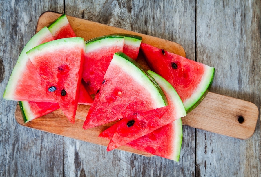 Personal care at home can help prepare healthy snacks like watermelon for aging seniors.