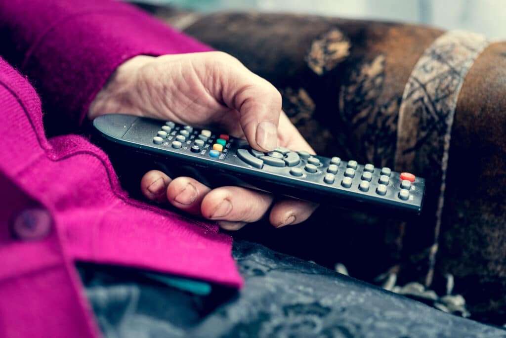 Home care assistance can help seniors with hearing loss set up captioning on their TV for better enjoyment.